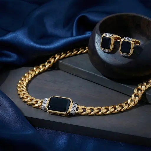 Close-up: ornate gold jhumka earrings on rich silk with zari embroidery.